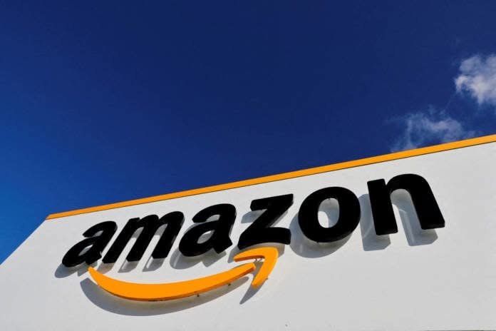 Amazon U.S. operations employees working inside a company facility following the announcement of a $20 hourly minimum starting wage.