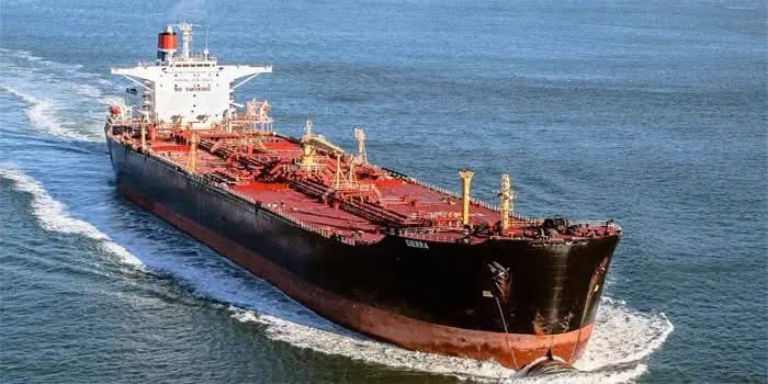 Oil tanker and cargo vessels at a Lagos port in Nigeria amid changing crude oil import volumes.