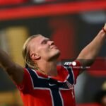 Erling Haaland of Norway celebrates after scoring an international goal during a UEFA Nations League match.