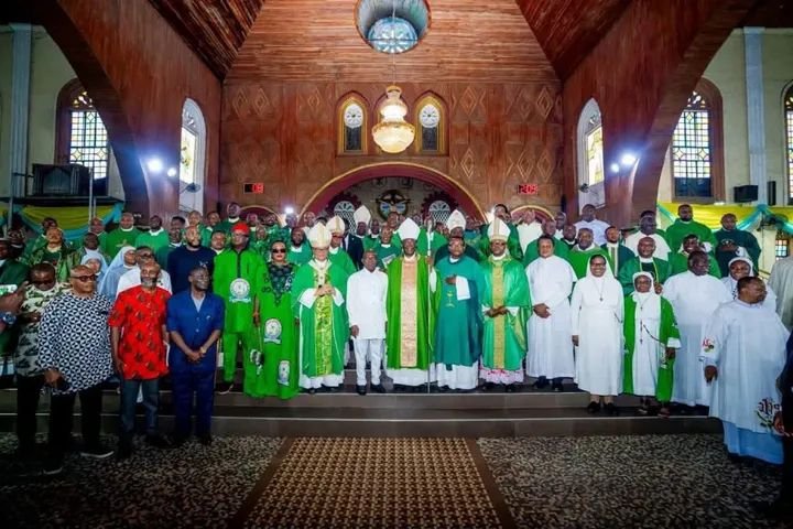 Catholic Bishop Augustine Echema with Abia State Governor Alex Otti during a Catholic event in Aba.