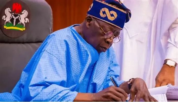 President Bola Ahmed Tinubu signing the 2025 budget amendment bill at the State House in Abuja, extending its implementation to December 31, 2026.
