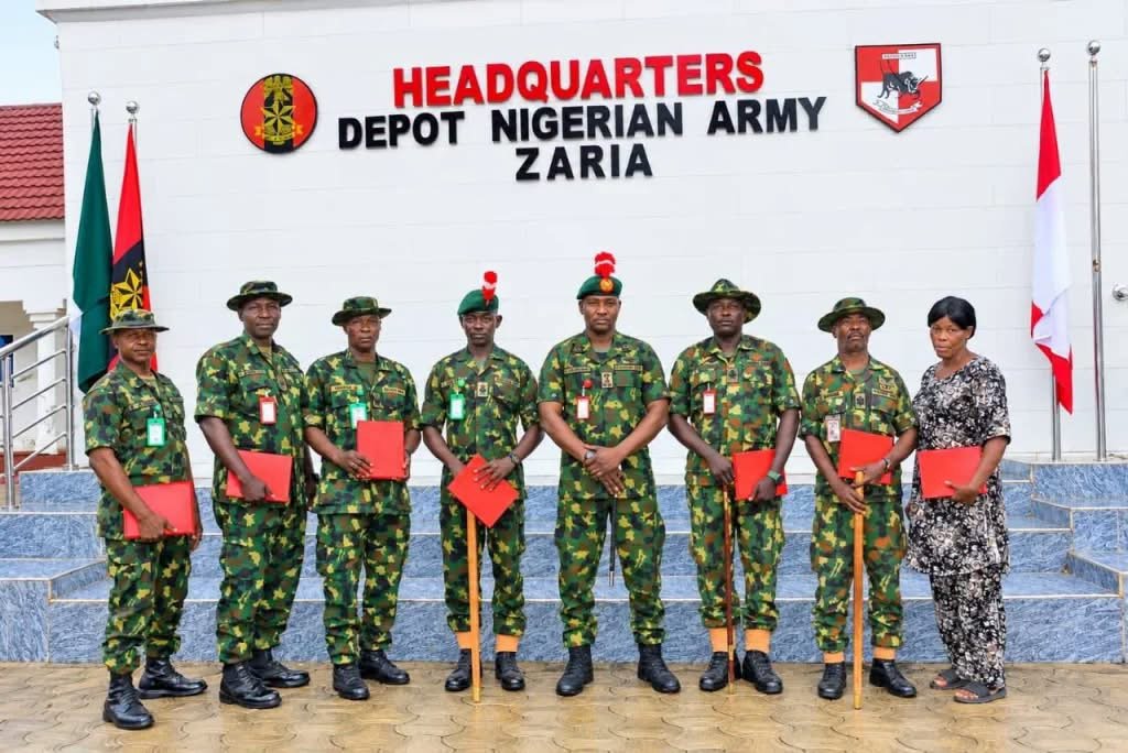Nigerian Army officials with discharged Master Warrant Officers during a send-off ceremony at Depot Nigerian Army in Zaria, Kaduna State.