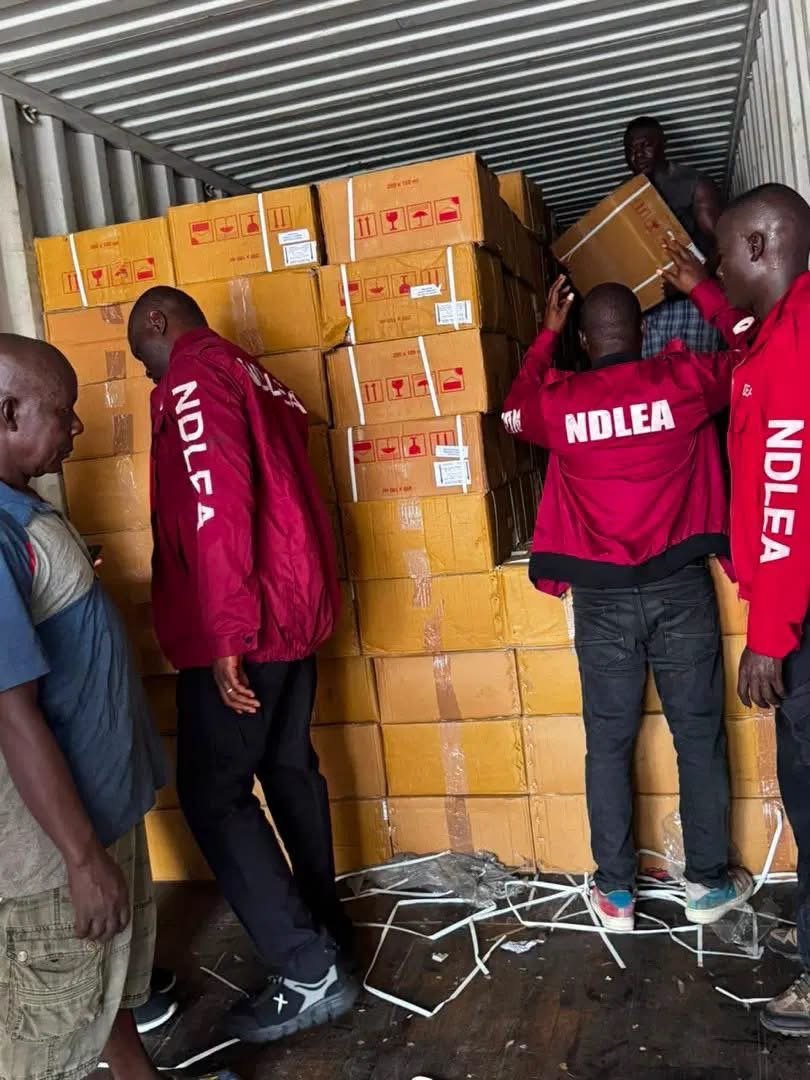 NDLEA operatives display seized Loud cannabis and codeine-based cough syrup recovered from containers at Apapa, Tin Can Island and Onne ports.