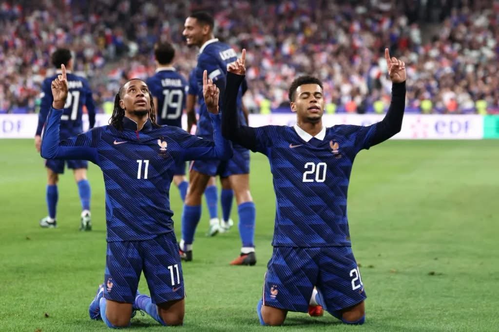 Michael Olise celebrates after scoring twice for France in a 4-1 UEFA Nations League comeback win over Belgium in Paris.