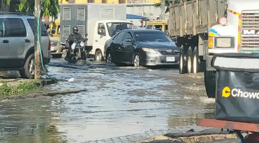 Floodwater covers a road around Ogba, Agege and Wempco Road in Lagos as motorists struggle to navigate traffic after heavy rainfall.