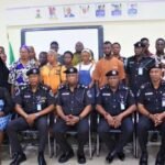Ogun State Police Commissioner presents insurance benefit cheque to families of fallen police officers during a ceremony in Ogun State.